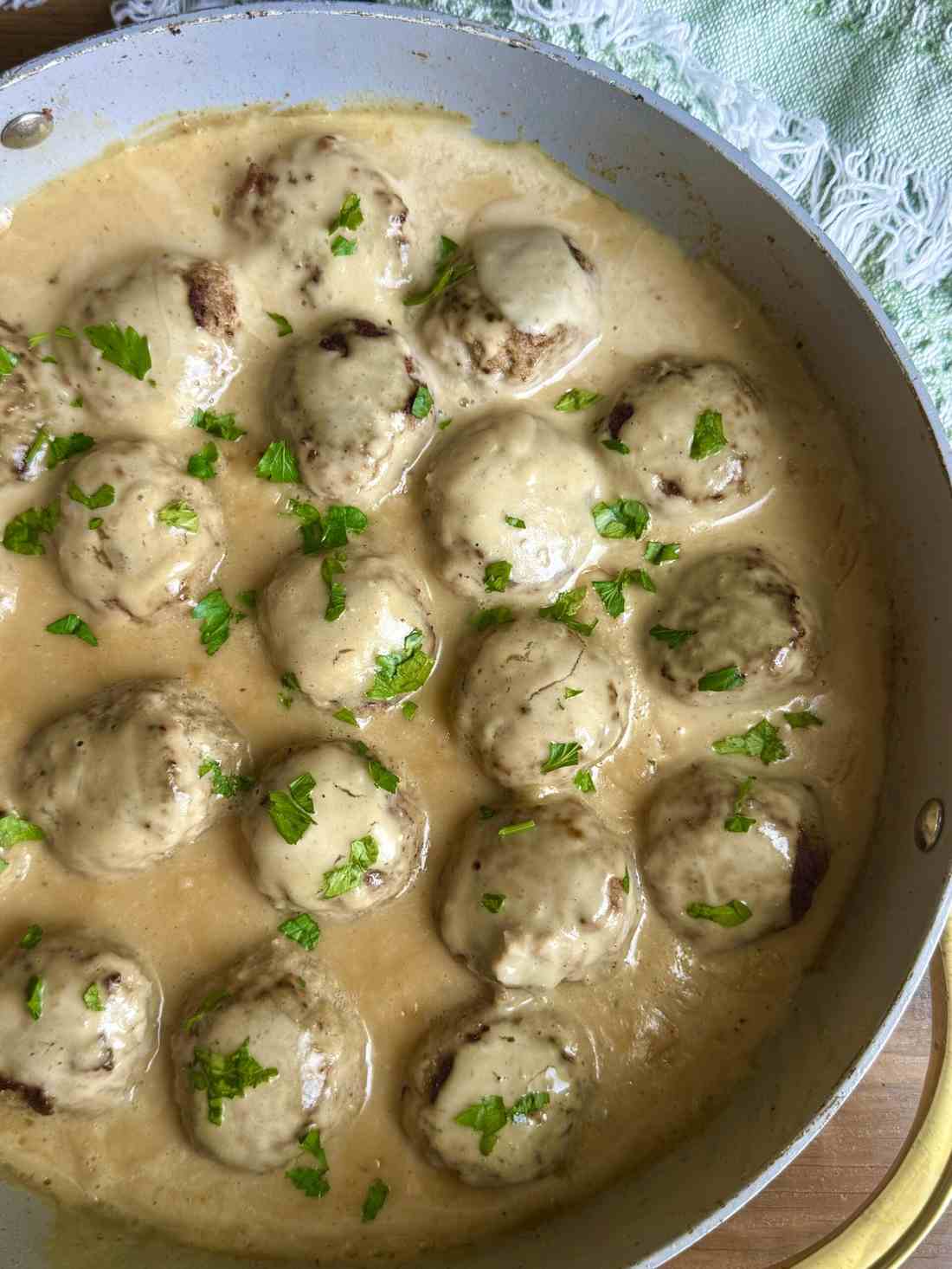 Lean golden ground turkey meatballs coated in savory, lightened Swedish cream gravy