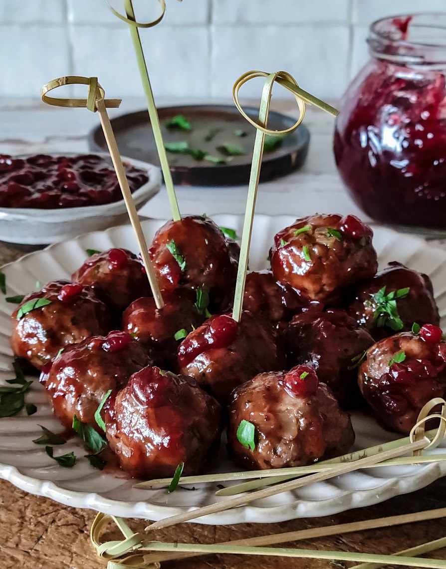 Bite-sized mini Swedish meatballs served on bamboo toothpicks with warm cream dip alongside