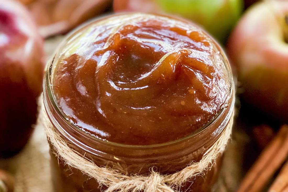 Rustic apple butter baked in oven, caramel apple aroma, cinnamon, cloves, mason jar