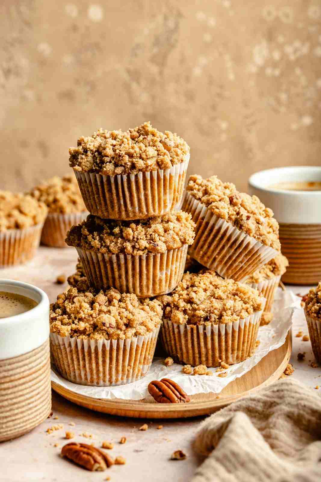 Golden apple butter streusel muffins with crunchy topping, served warm