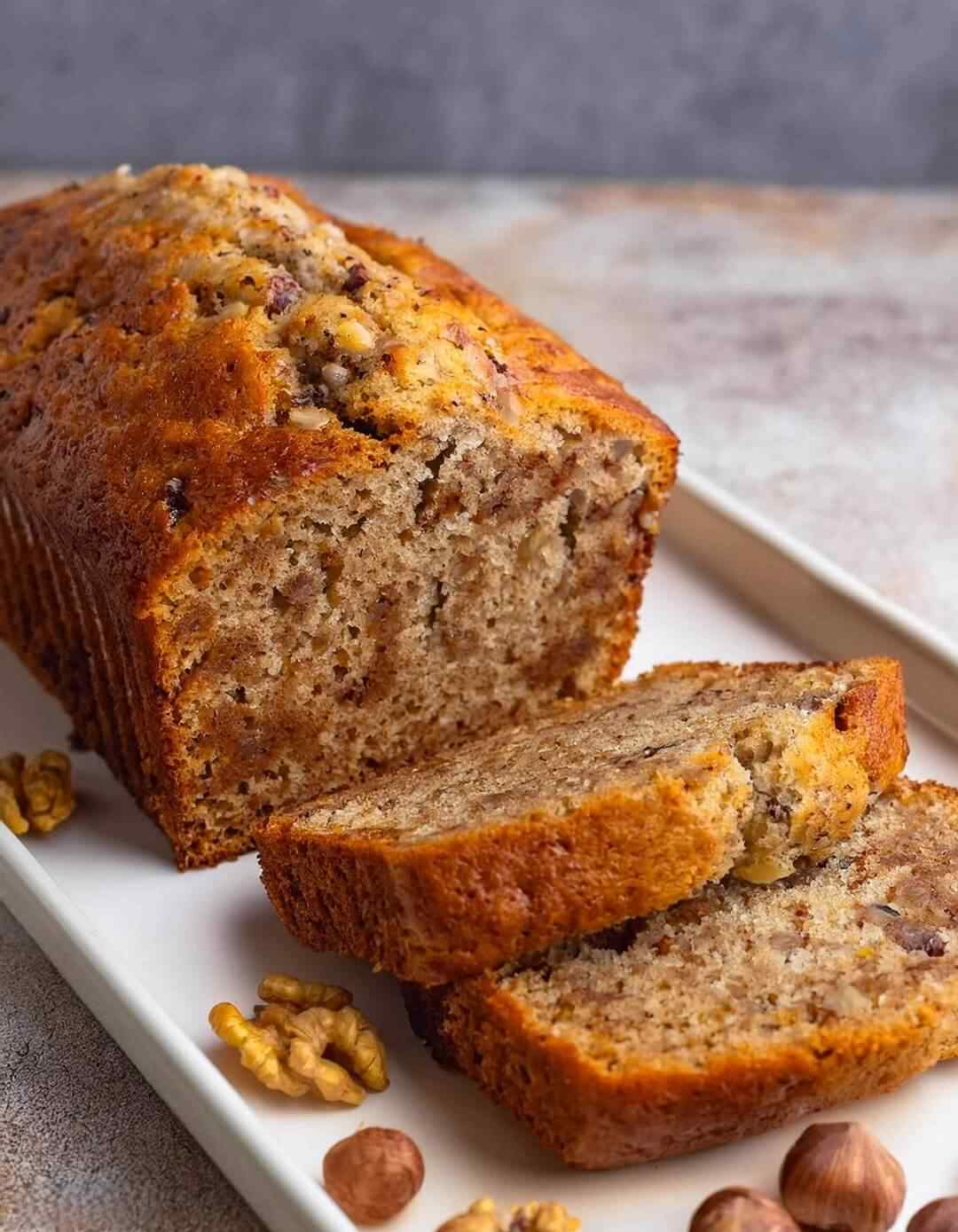 Golden‑brown walnut‑crunch banana bread with tender crumb and caramelized banana aroma