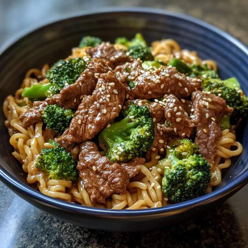 Sesame beef and broccoli noodle bowl with tender beef, crisp broccoli, and glossy noodles