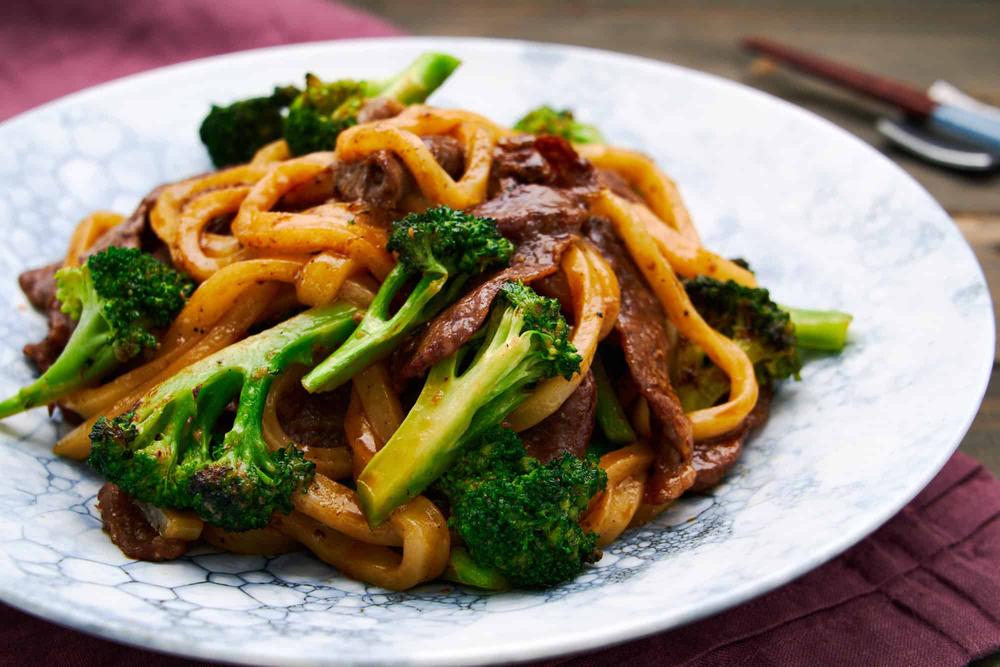 Beef yaki udon with broccoli featuring tender beef, crisp broccoli, and glossy noodles