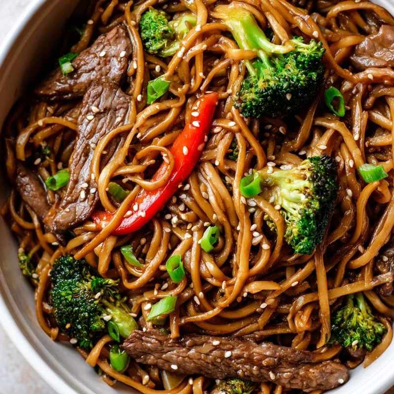 Beef and broccoli noodles with red chili, tender beef, crisp broccoli, glossy noodles in a spicy sauce