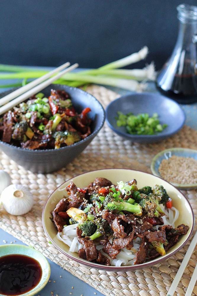 Beef and broccoli over thin rice noodles with tender beef, crisp broccoli, glossy noodles