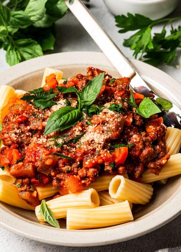 Rigatoni baked with rich bolognese sauce, topped with melted mozzarella and basil.