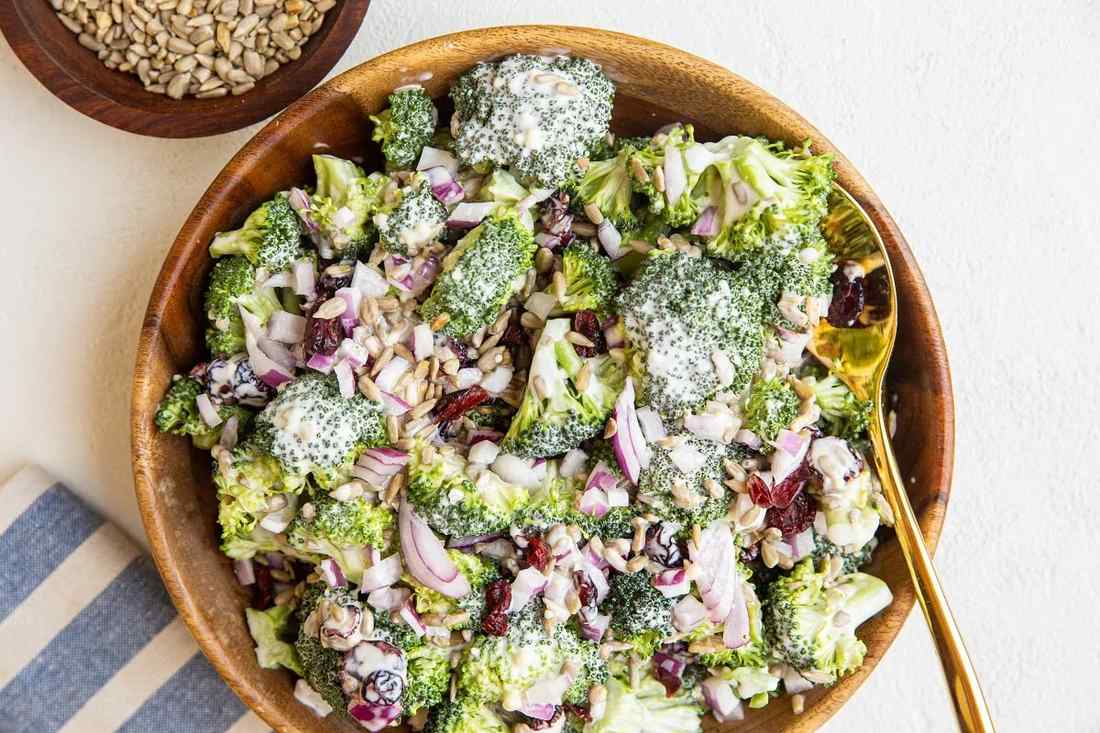 Grilled broccoli salad with smoky char, honey‑mustard dressing, pine nuts, dried cherries, shaved manchego