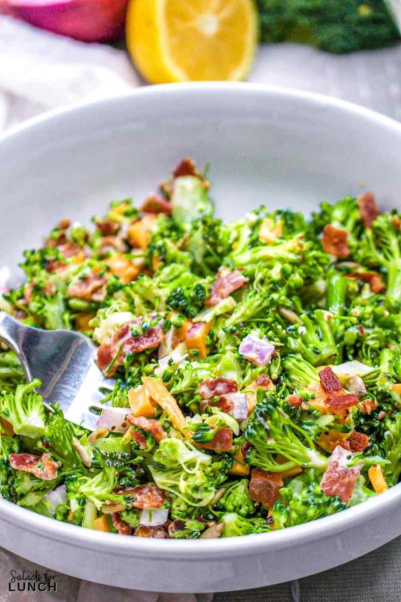 Broccoli bacon cheddar salad with crispy bacon, sharp cheddar, toasted walnuts, honey‑mustard dressing, dried cranberries