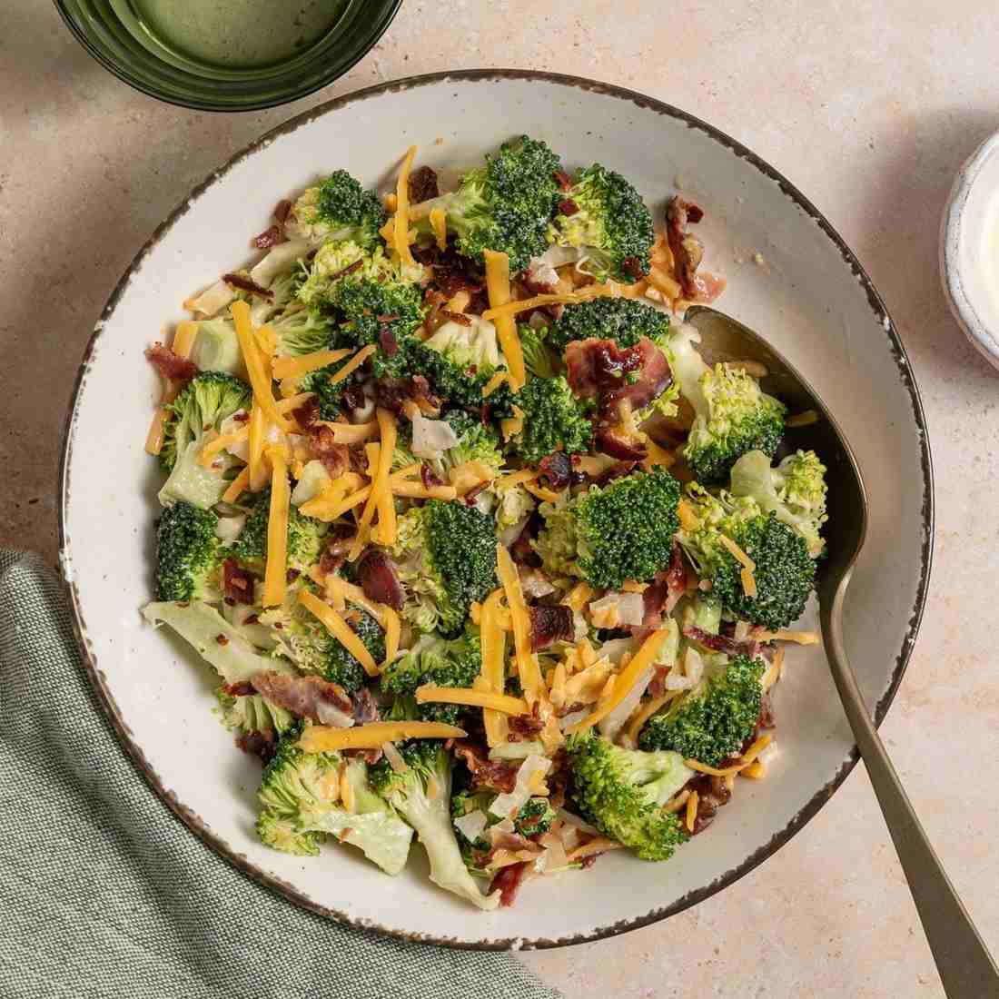 Broccoli bacon cheddar salad with smoked paprika, pecans, maple glaze, shredded mozzarella, dried apricots