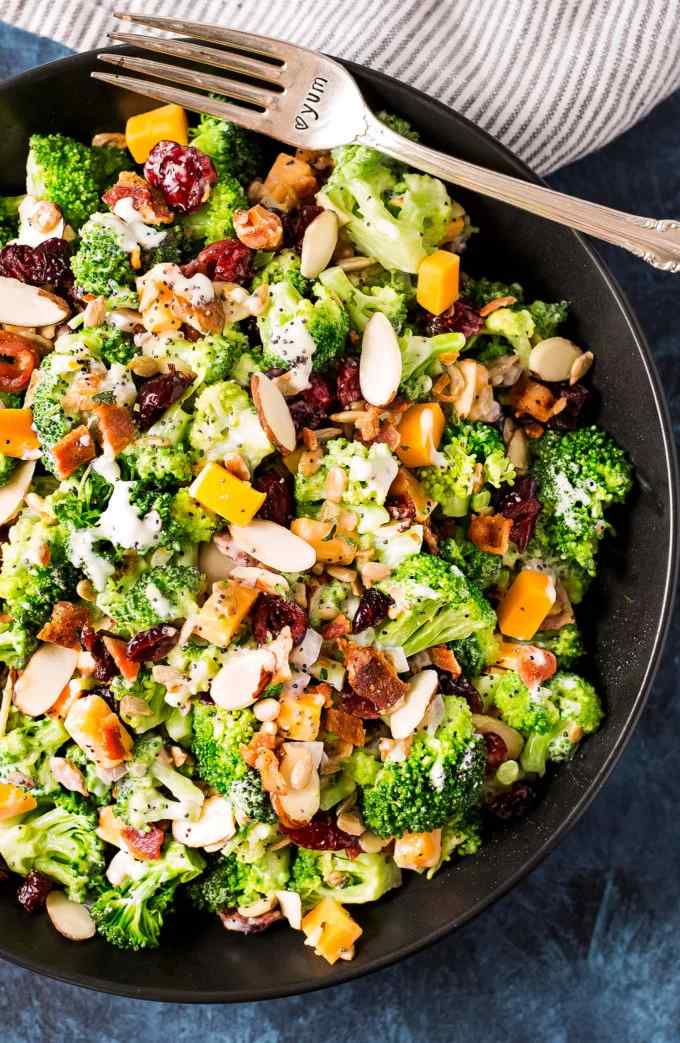 Zesty classic broccoli salad featuring crisp florets, sunflower seeds, cheddar, bacon, and sweet vinaigrette