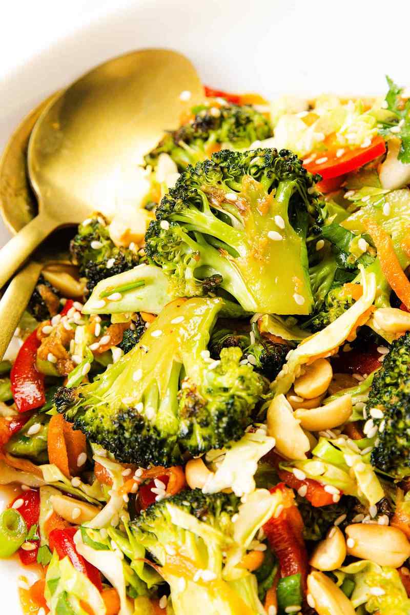 Vibrant Asian sesame broccoli salad with crisp florets, toasted sesame, soy‑ginger dressing, peanuts, mandarin slices