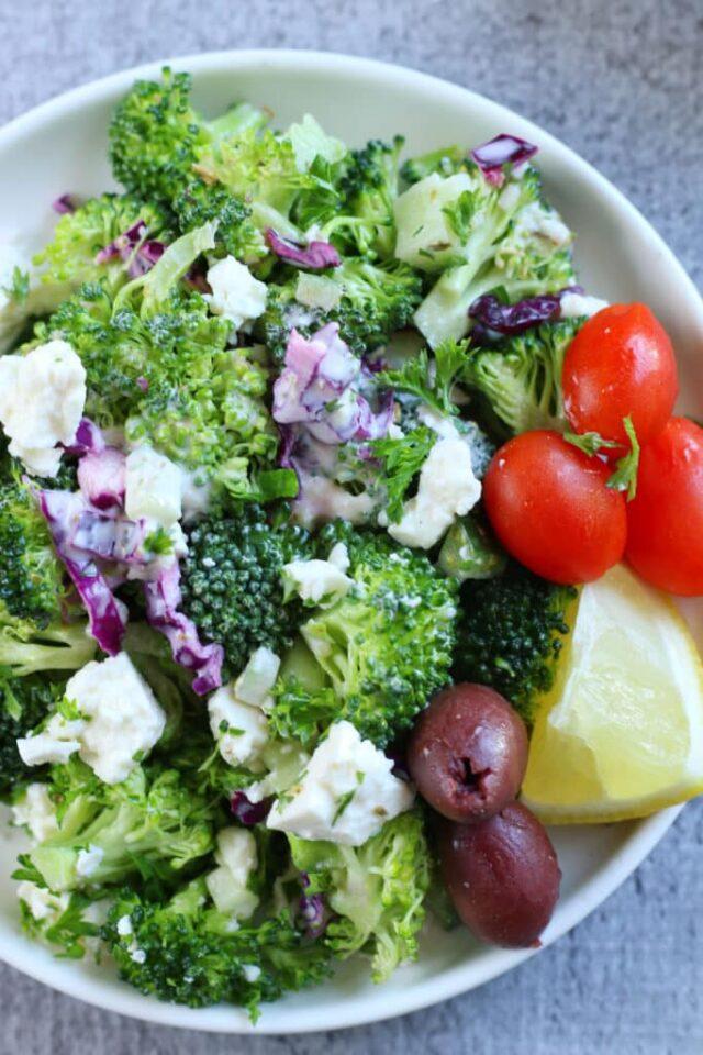 Mediterranean broccoli salad with crisp florets, crumbled feta, Kalamata olives, cherry tomatoes, and lemon‑herb vinaigrette