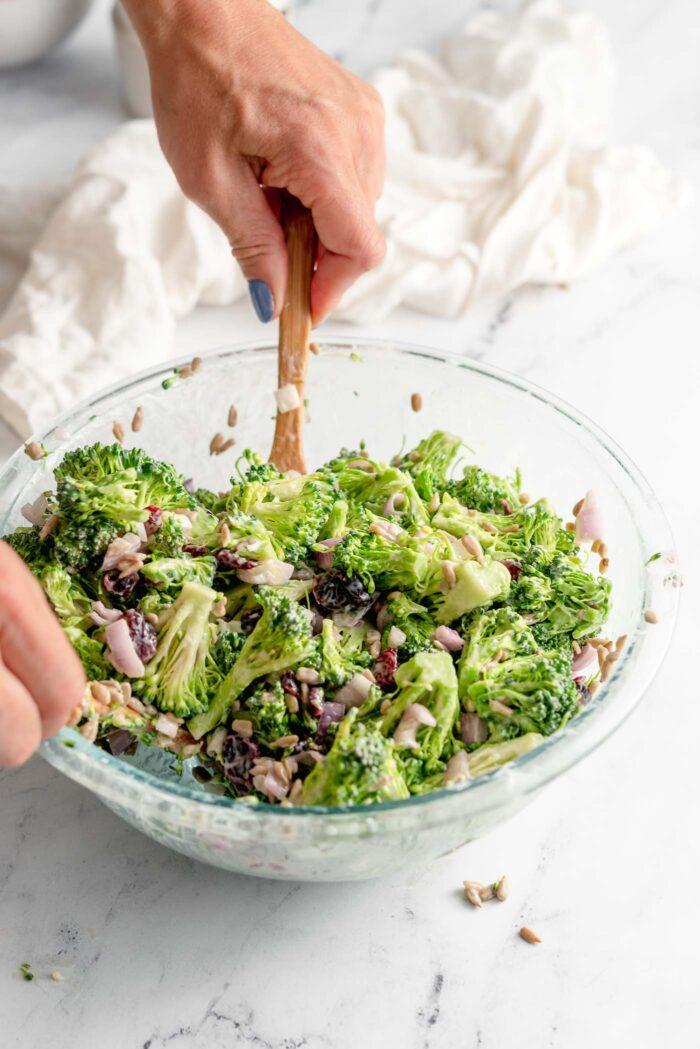 Broccoli cranberry almond salad with crisp florets, tangy cranberry vinaigrette, toasted almonds, and shaved parmesan cheese