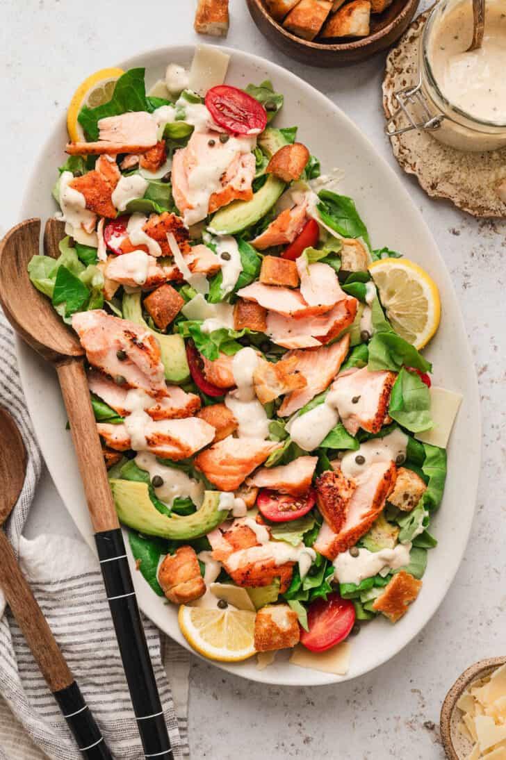 Grilled salmon caesar salad topped with crisp romaine, crunchy croutons, shaved parmesan, and creamy dressing.