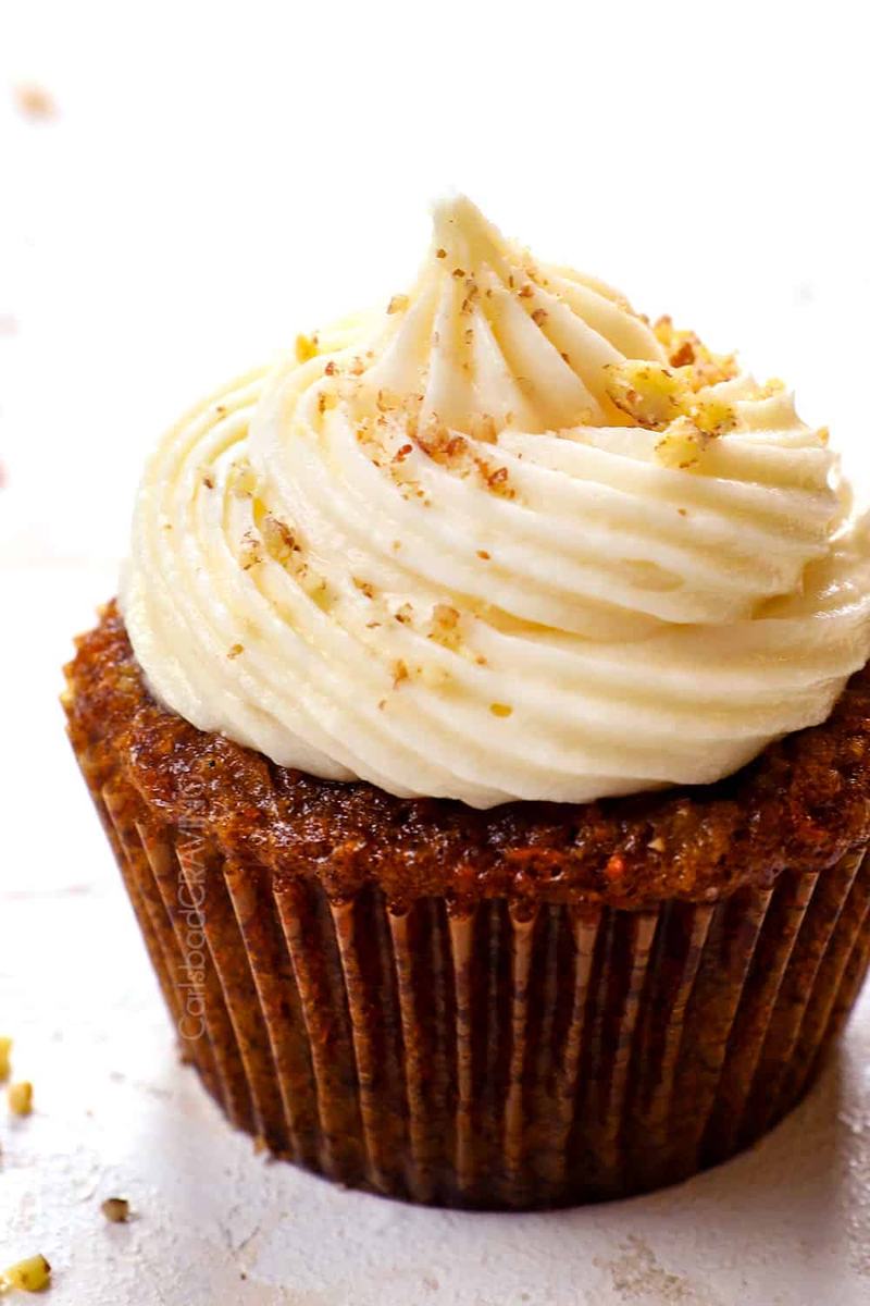 Best carrot cake cupcakes topped with luscious cream cheese frosting and a drizzle of caramel