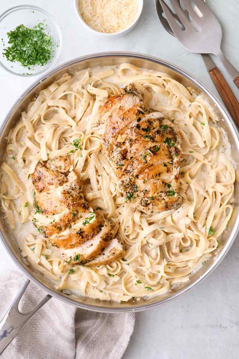 Classic fettuccine chicken alfredo with tender chicken, creamy parmesan sauce, and silky pasta strands