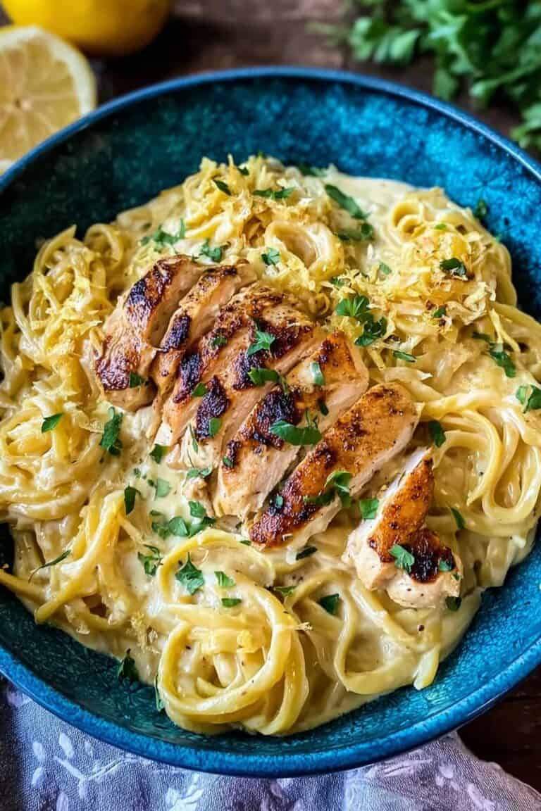 Tender chicken breast sliced over classic fettuccine coated in silky parmesan cream sauce