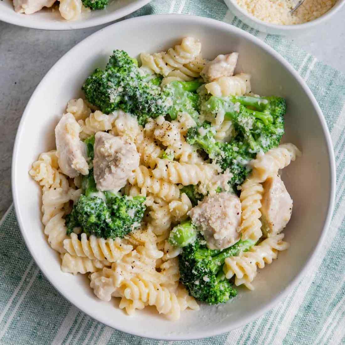 Delicious chicken alfredo with broccoli, tender chicken, and silky parmesan cream sauce over fettuccine.