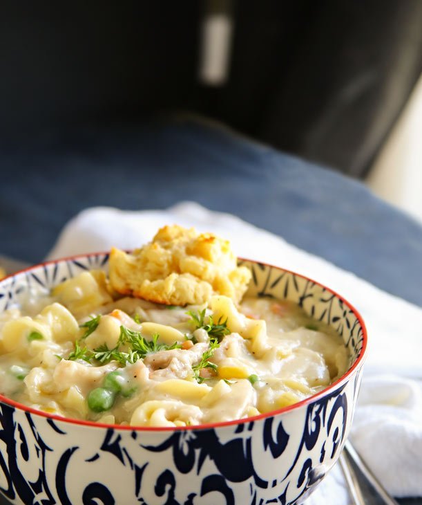 Creamy chicken pot pie soup with Parmesan‑crusted biscuit topping, chicken, peas, carrots, potatoes