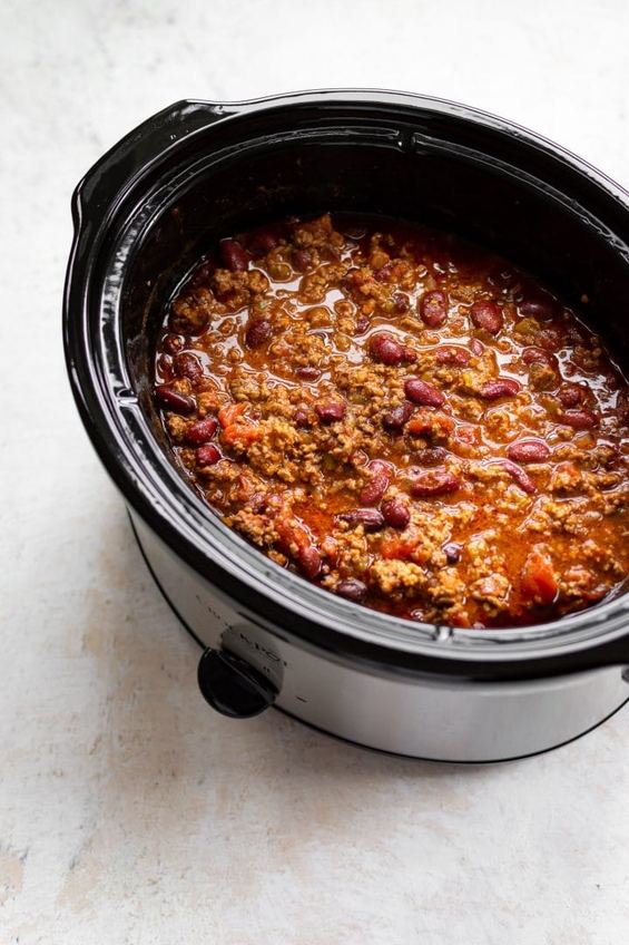 Rich slow‑cooked beef chili with beans, melted cheese, sour cream, jalapenos, chipotle cocoa flavor