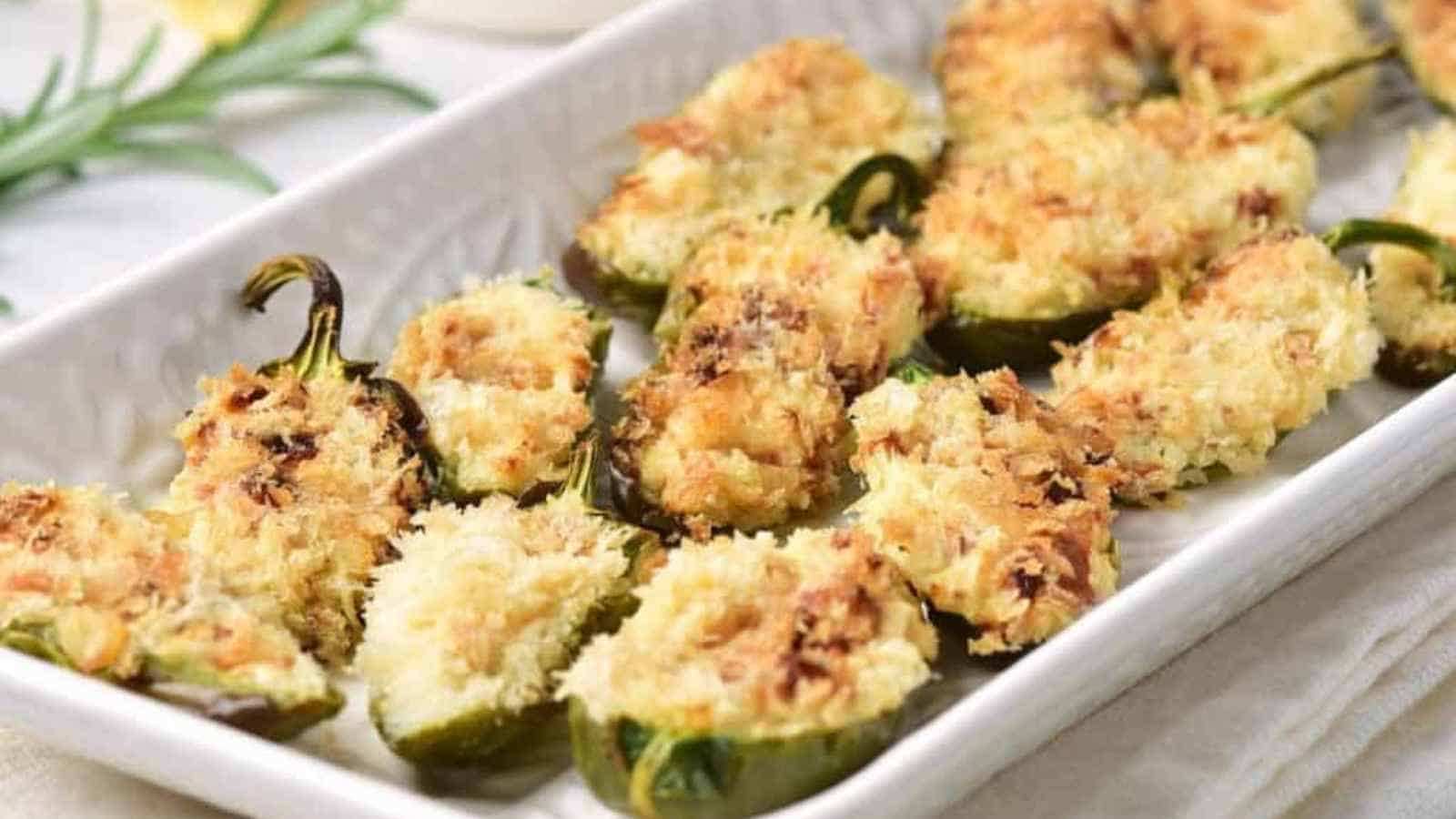 Crispy baked jalapeño halves stuffed with cheese and crunchy panko, arranged on a holiday platter