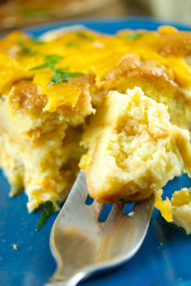 Layered casserole with golden egg custard, melted cheese, and baked bread cubes