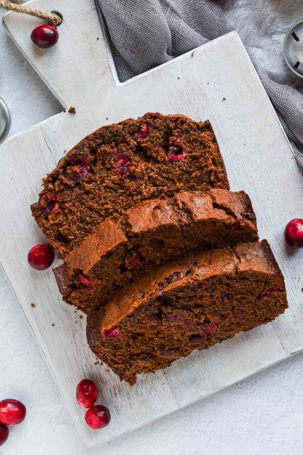 Spiced gingerbread loaf studded with dried cranberries and a dusting of powdered sugar