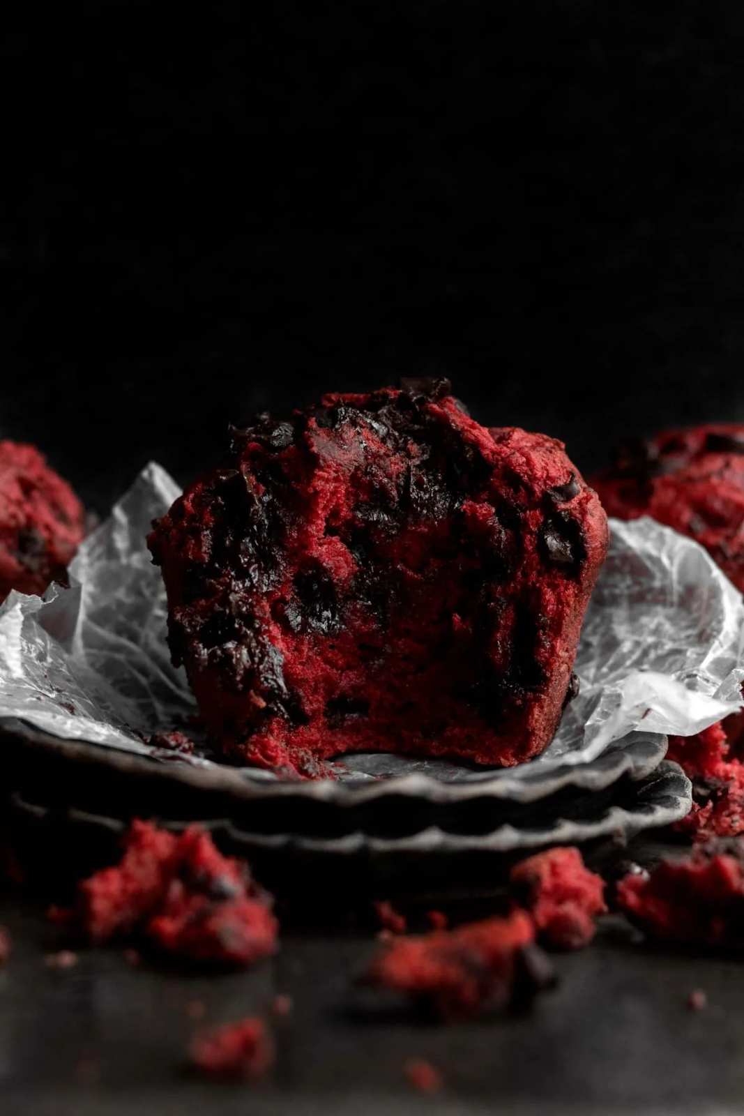 Deep red muffins studded with chocolate chips and a light cream cheese swirl