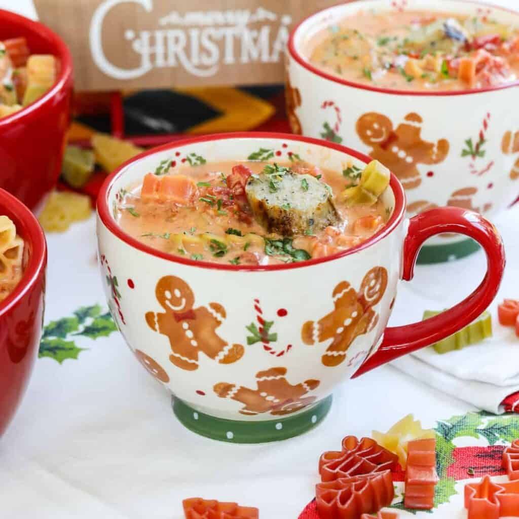 Hearty soup with cheese tortellini, Italian sausage, and a creamy broth, topped with fresh basil