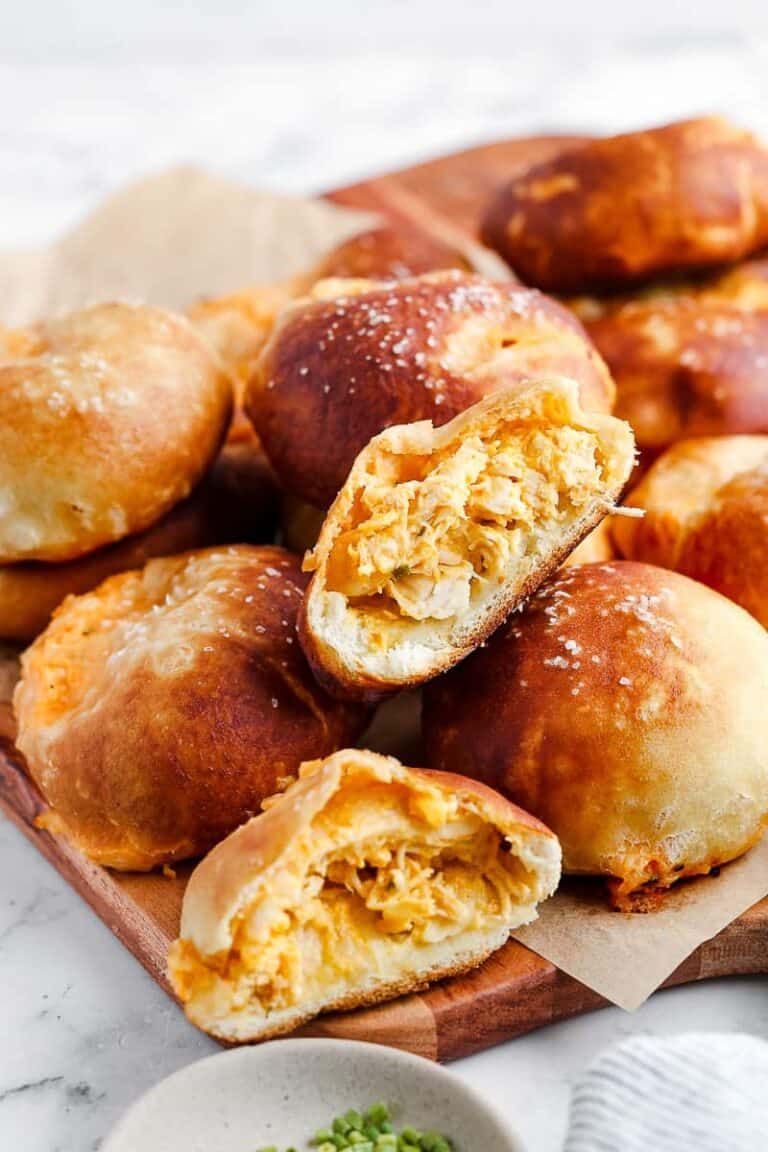 Soft pretzel bites filled with spicy buffalo chicken, drizzled with blue cheese