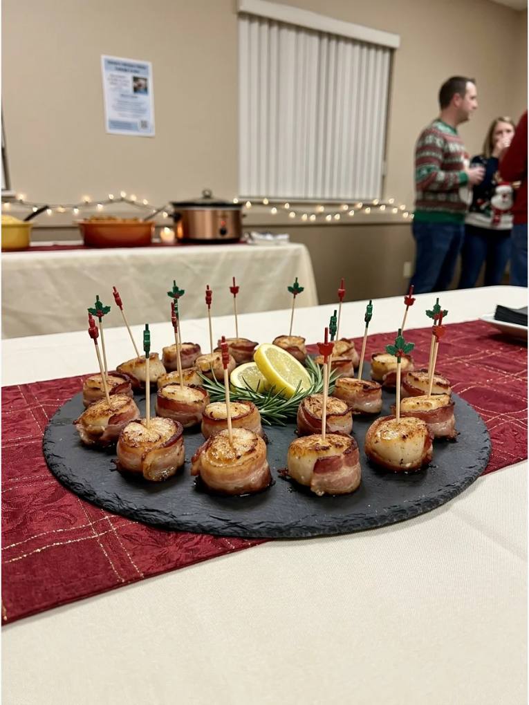 Succulent scallops wrapped in crisp bacon, threaded on green holly-shaped skewers, glazed with lemon butter