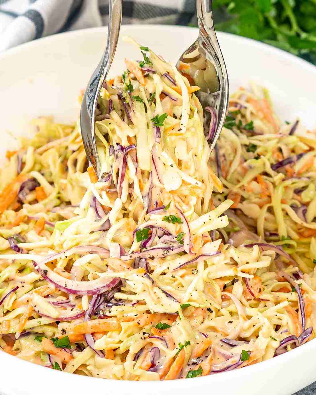 Smoky creamy coleslaw topped with crisp cabbage, spiced dressing, and zesty cool crunch.