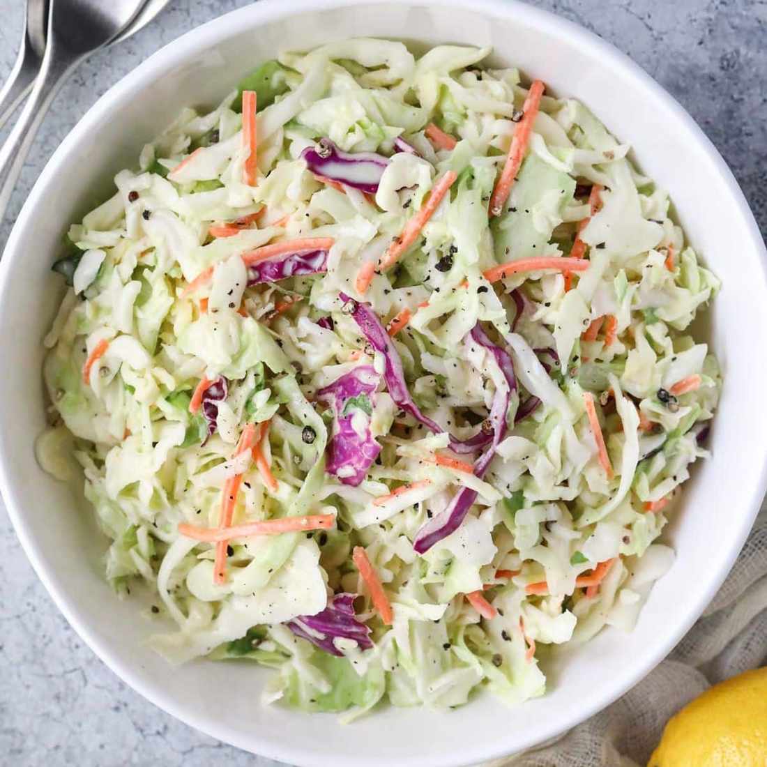 Spicy Southern coleslaw with mustard‑tangy dressing, crisp cabbage, and red pepper flakes