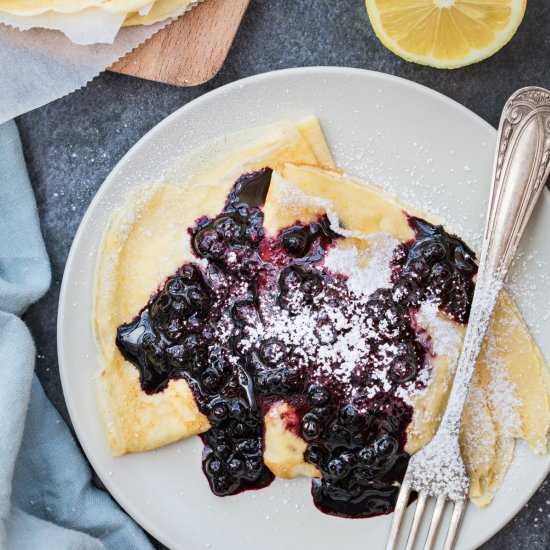 Thin golden French crepes filled with fresh berries, finished with powdered sugar and fresh mint