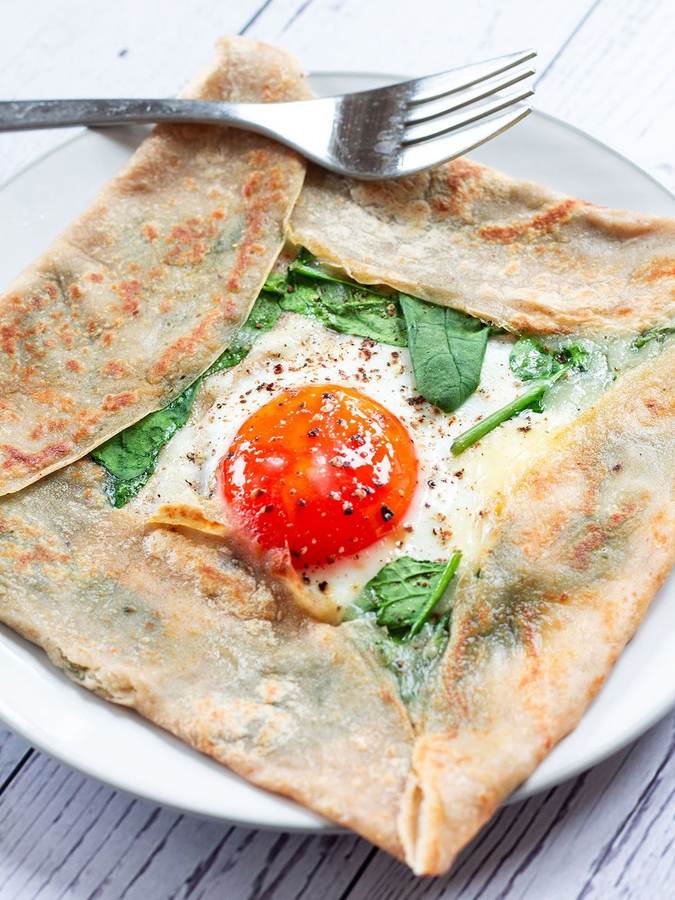 Thin golden buckwheat crepes filled with sautéed mushrooms and spinach, topped with grated cheese