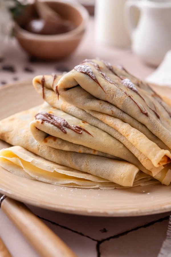 Thin golden crepes slathered with Nutella, chocolate shavings, and a sprinkle of sea salt