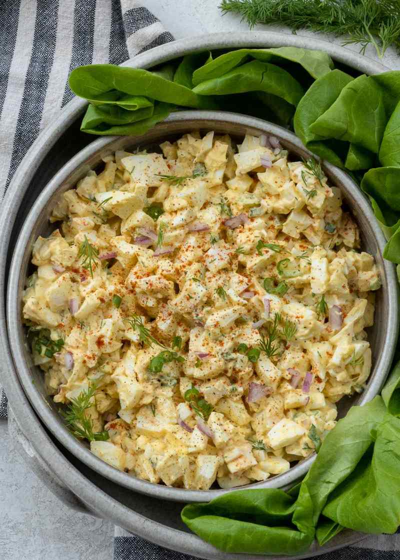 Classic creamy egg salad with diced hard‑boiled eggs, mayo, herbs, served on toasted bread slices