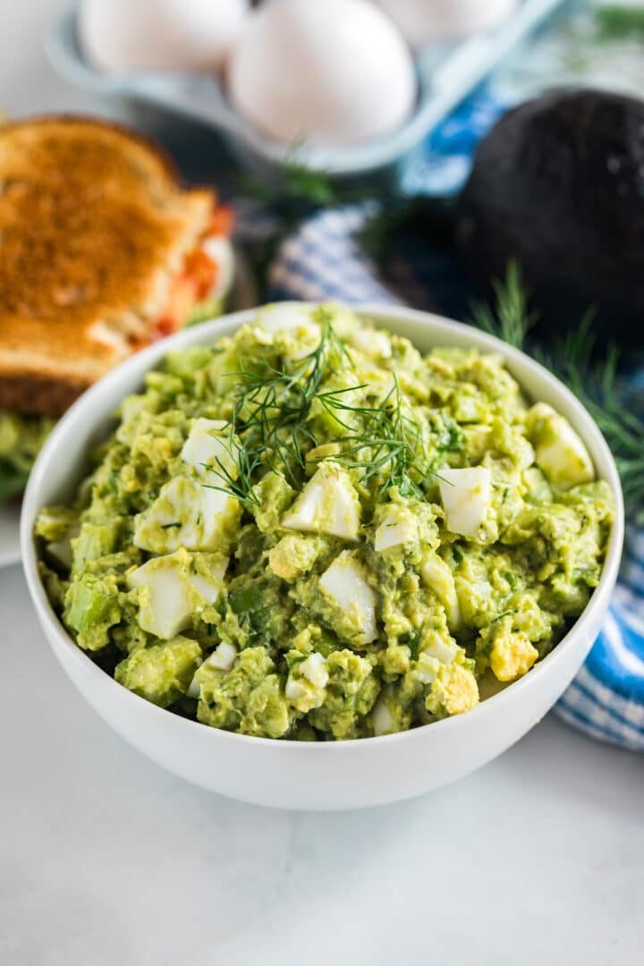 Creamy avocado egg salad with diced hard-boiled eggs, mashed avocado, Greek yogurt, dill, and a drizzle of lime