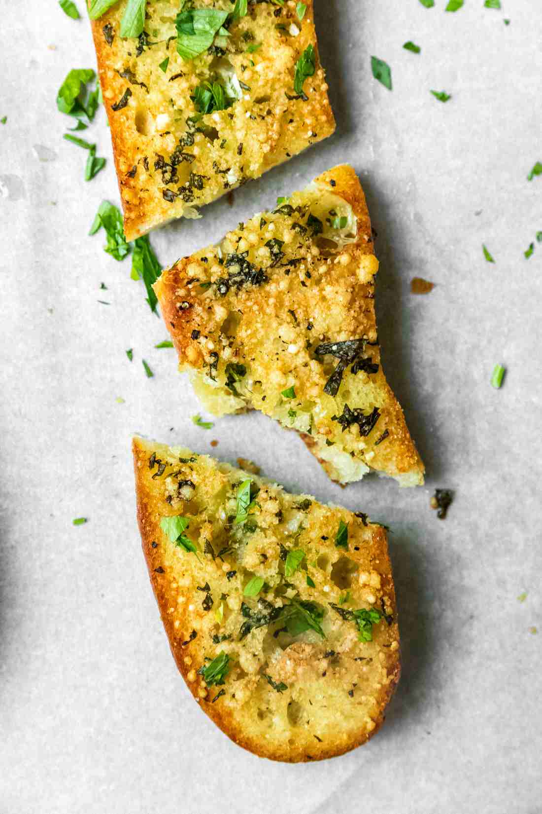 Rustic garlic bread with herb-infused butter, golden crust, and aromatic garlic