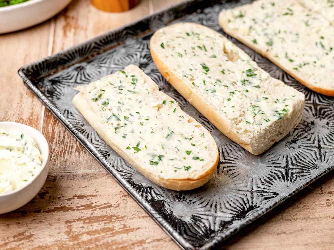 Flatbread smothered in garlic butter, chili flakes, and crisp golden edges