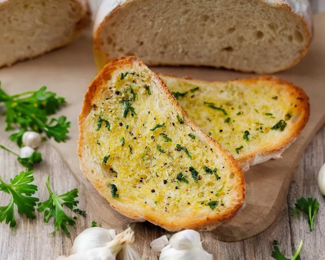 Classic garlic bread with gooey cheese, golden crust, and a sprinkle of paprika