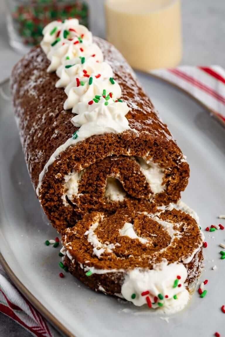 Rolled gingerbread cake filled with white eggnog cream.