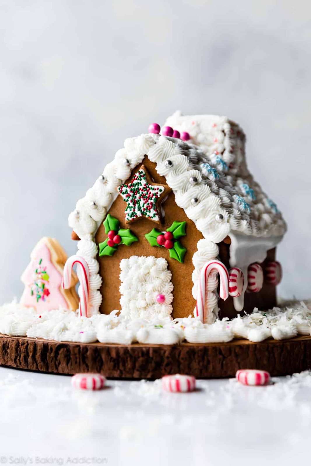 Detailed gingerbread house with candy decorations and icing.