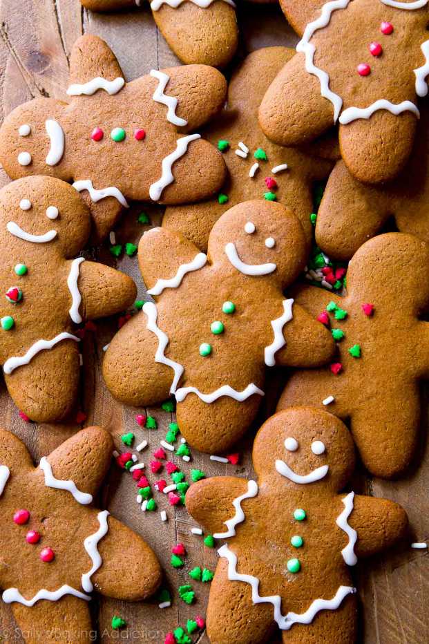 Intricately iced gingerbread cookies with red, green, and blue colors.