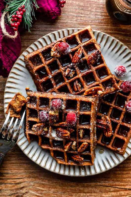 Golden brown waffles with a spiced, crisscross pattern.
