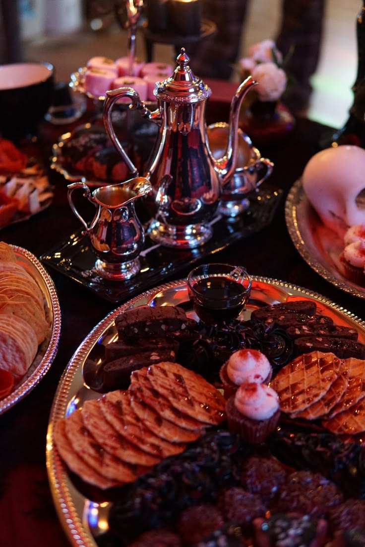 Dark red berry compote served with vanilla bean panna cotta in a silver bowl