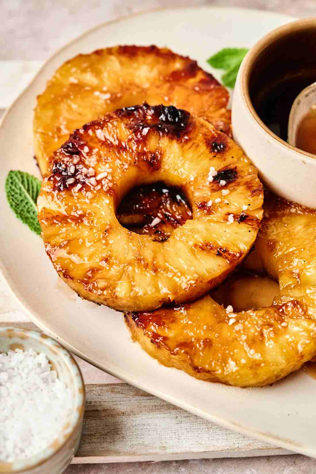Grilled pineapple rings, crisp broccoli florets, tangy dressing, toasted nuts, sweet dried fruit, melted cheese