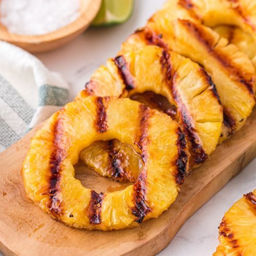 Grilled pineapple rings, crisp broccoli florets, tangy dressing, toasted nuts, sweet dried fruit, melted cheese