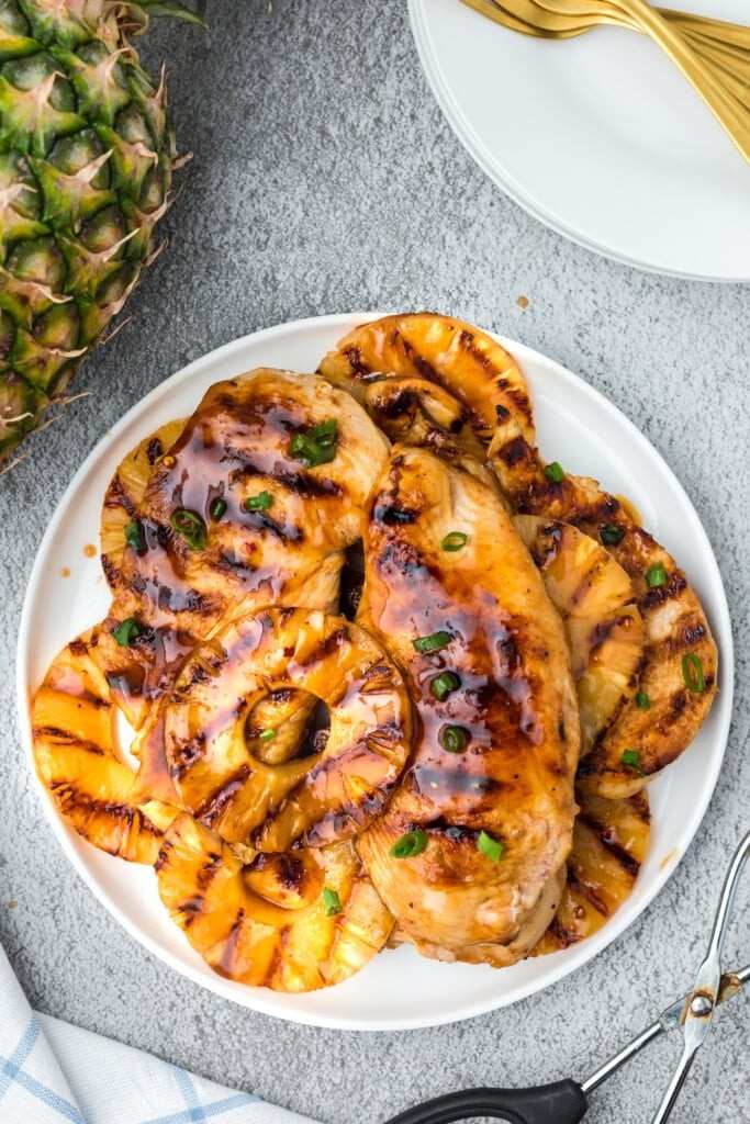 Grilled pineapple chicken, crisp broccoli florets, tangy dressing, toasted nuts, sweet dried fruit, melted cheese