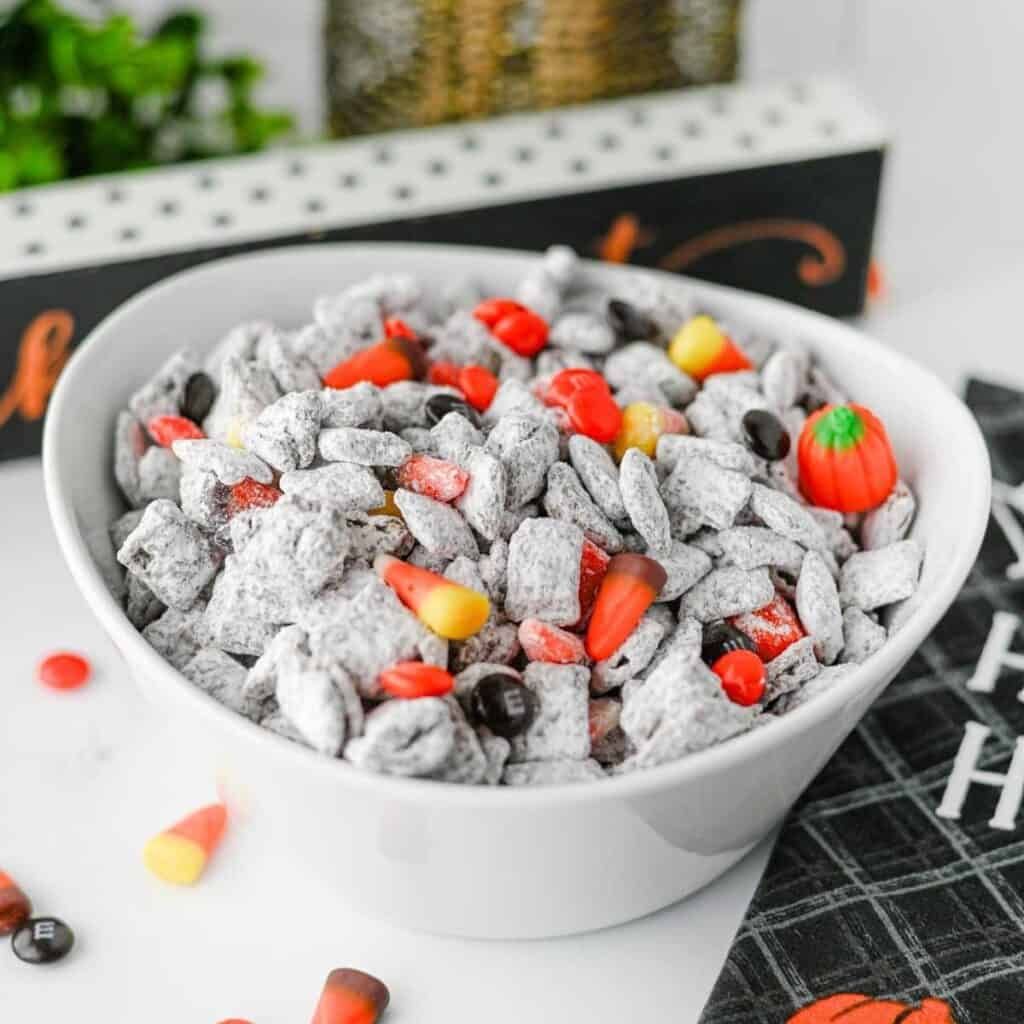 Chocolate‑coated rice cereal clusters dusted with green sprinkles, resembling swampy puddles.